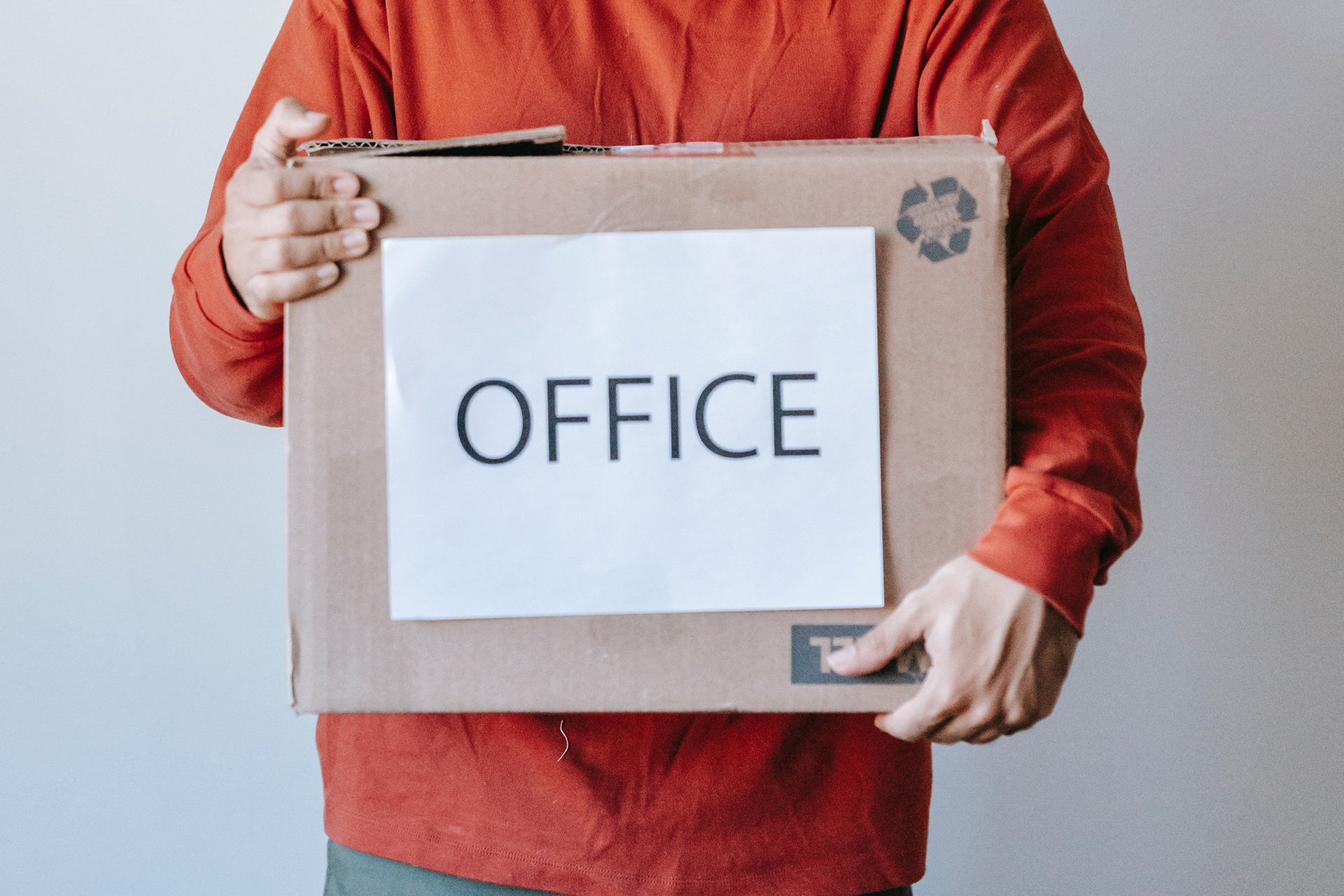 Office relocation box being carried during a small business move