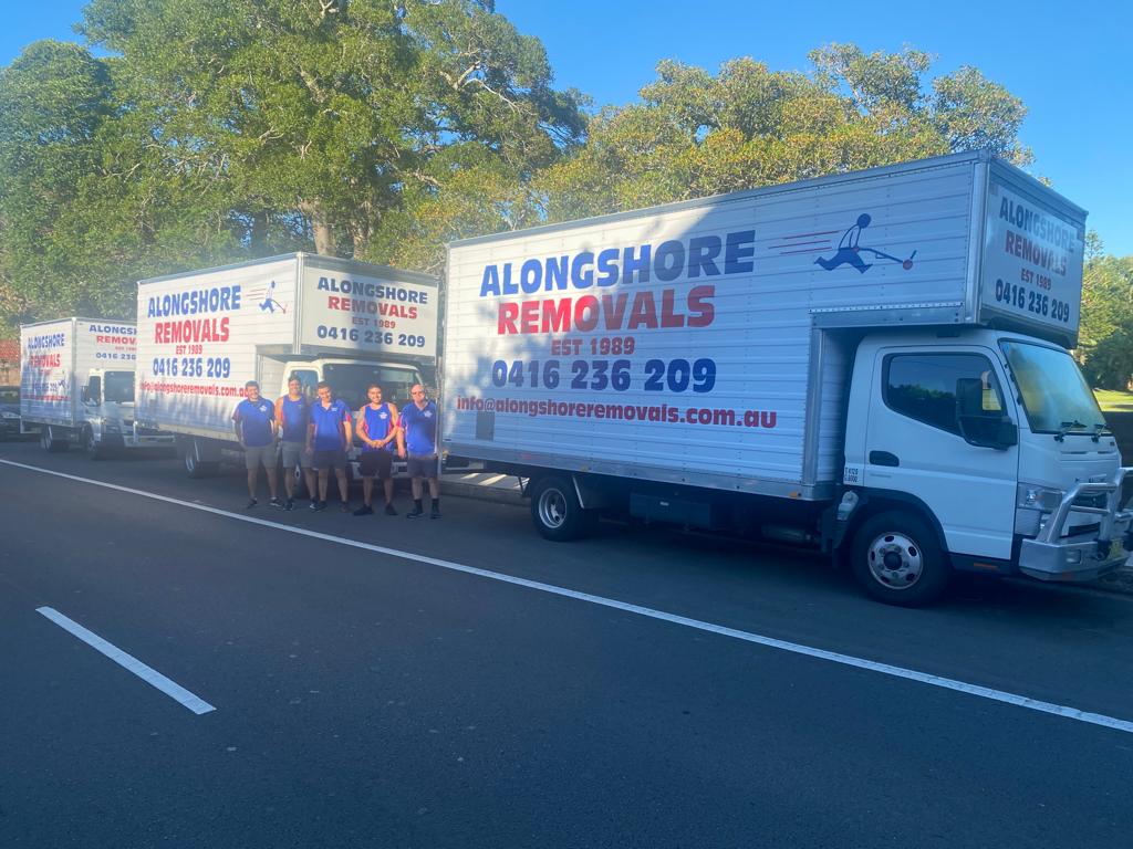 The Alongshore Removals crew in front of a company truck